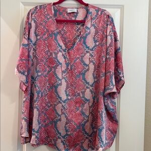 Adrienne Vibrant Pink and Blue Blouse will fit up to a 1X